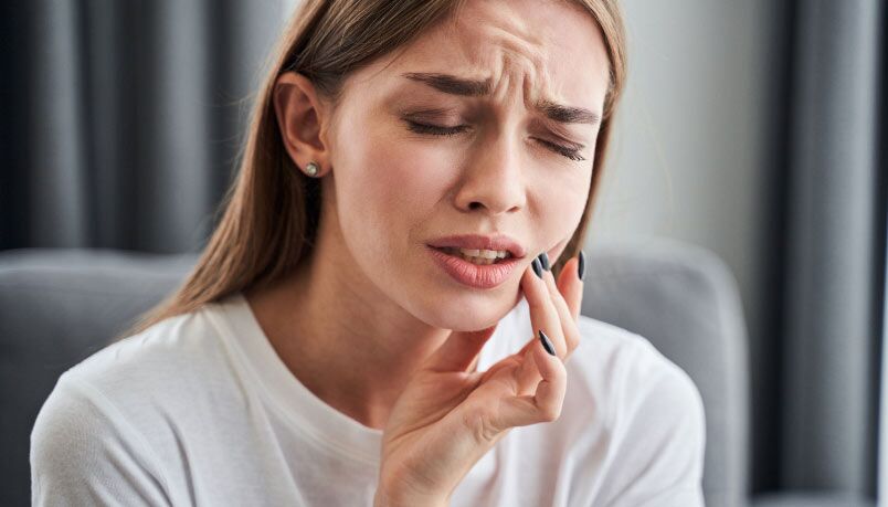 A Lady Having Pain On Her Left Teeth