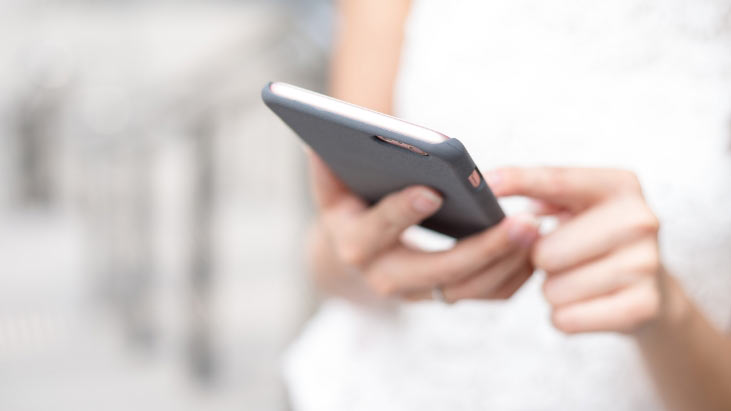 Women Scrolling Down Her Phone