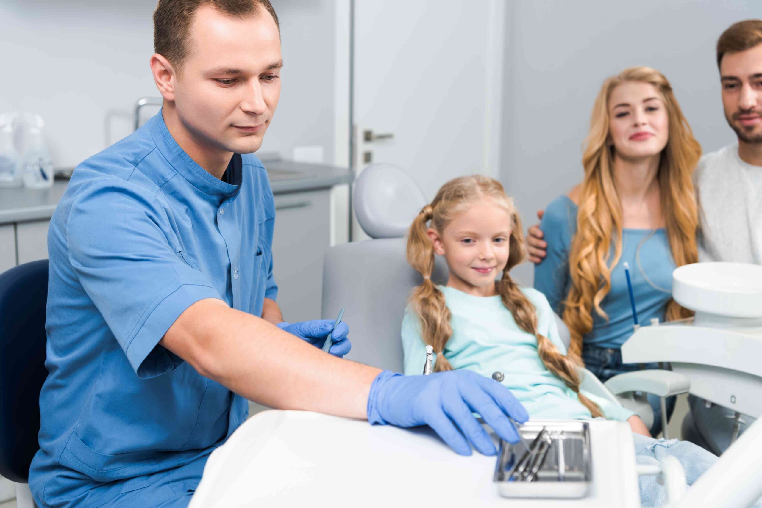Dentist with child and parents.